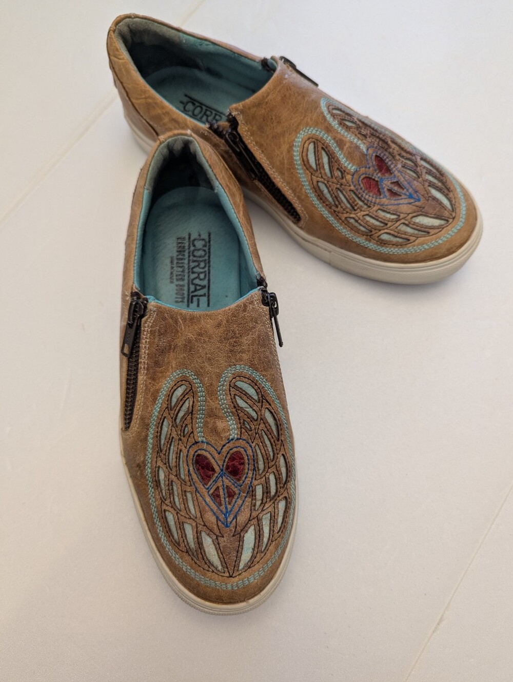 Corral Distressed Tan Winged Heart Peace Sign Embroidered Slip On shoe.